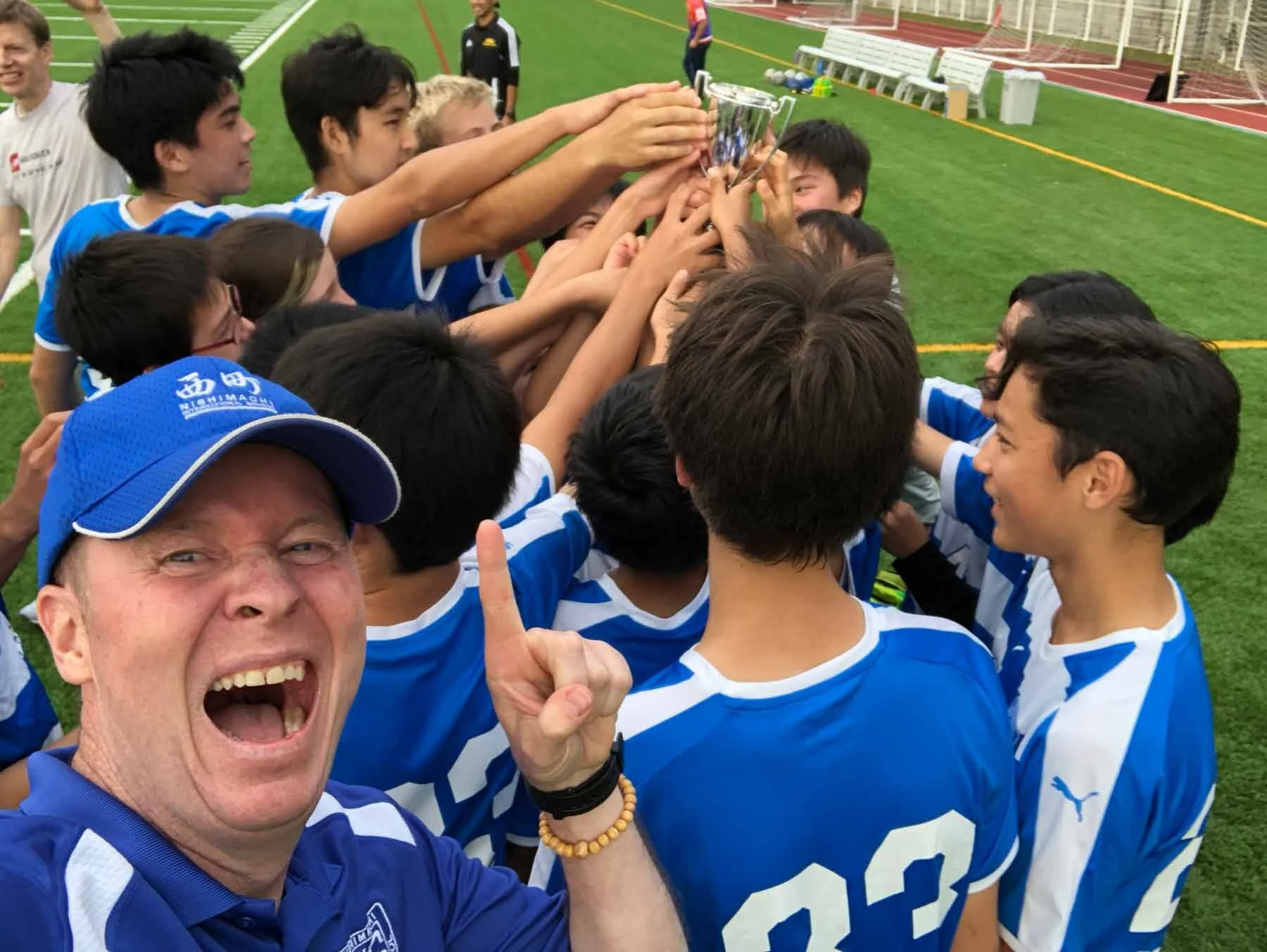 CoEd-Trophy-Huddle-Selfie.jpg