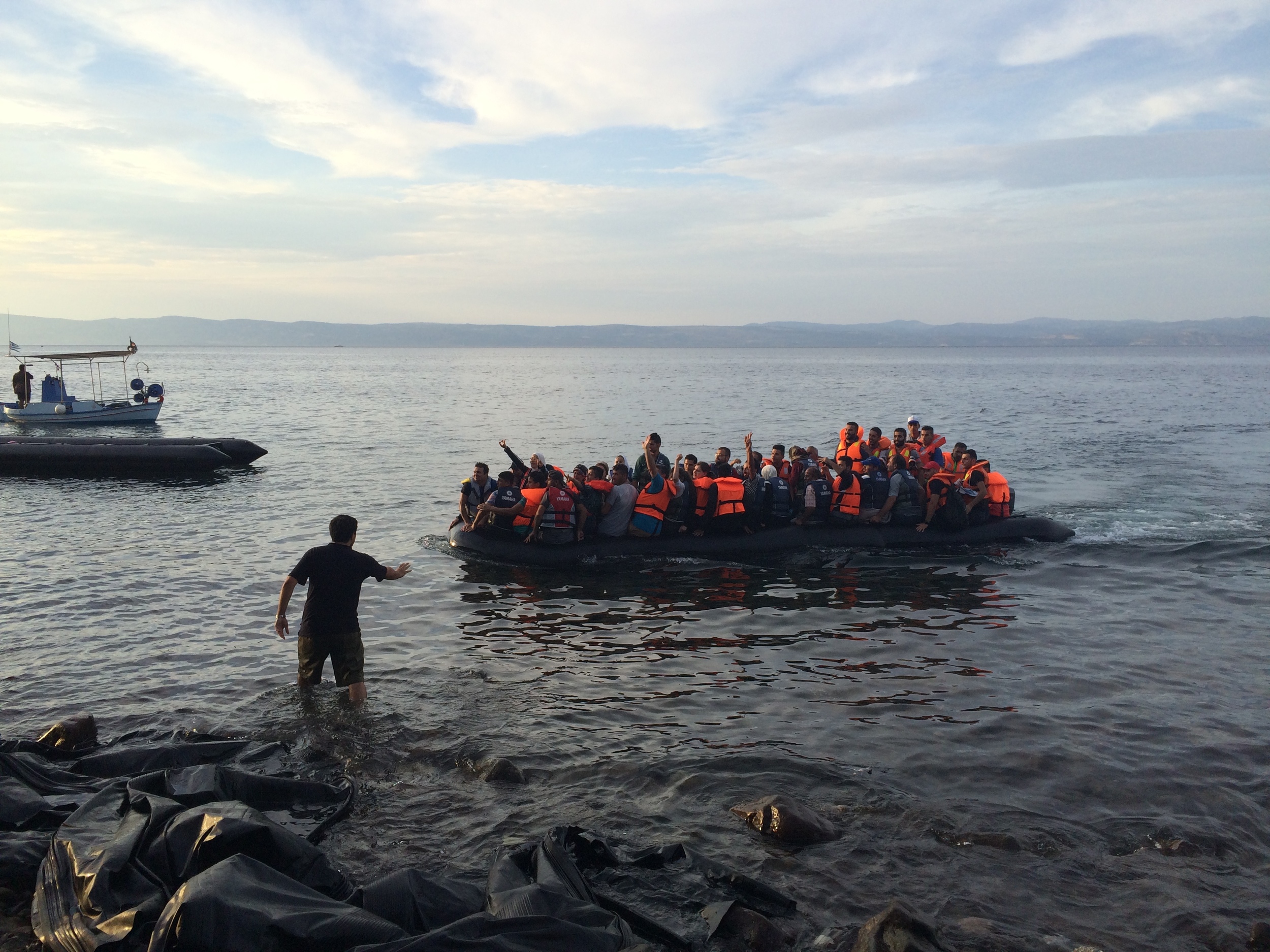 A migrant boat arrives at the beach at Skala Sikamineas, Lesbos, Greece. © Katy Lee