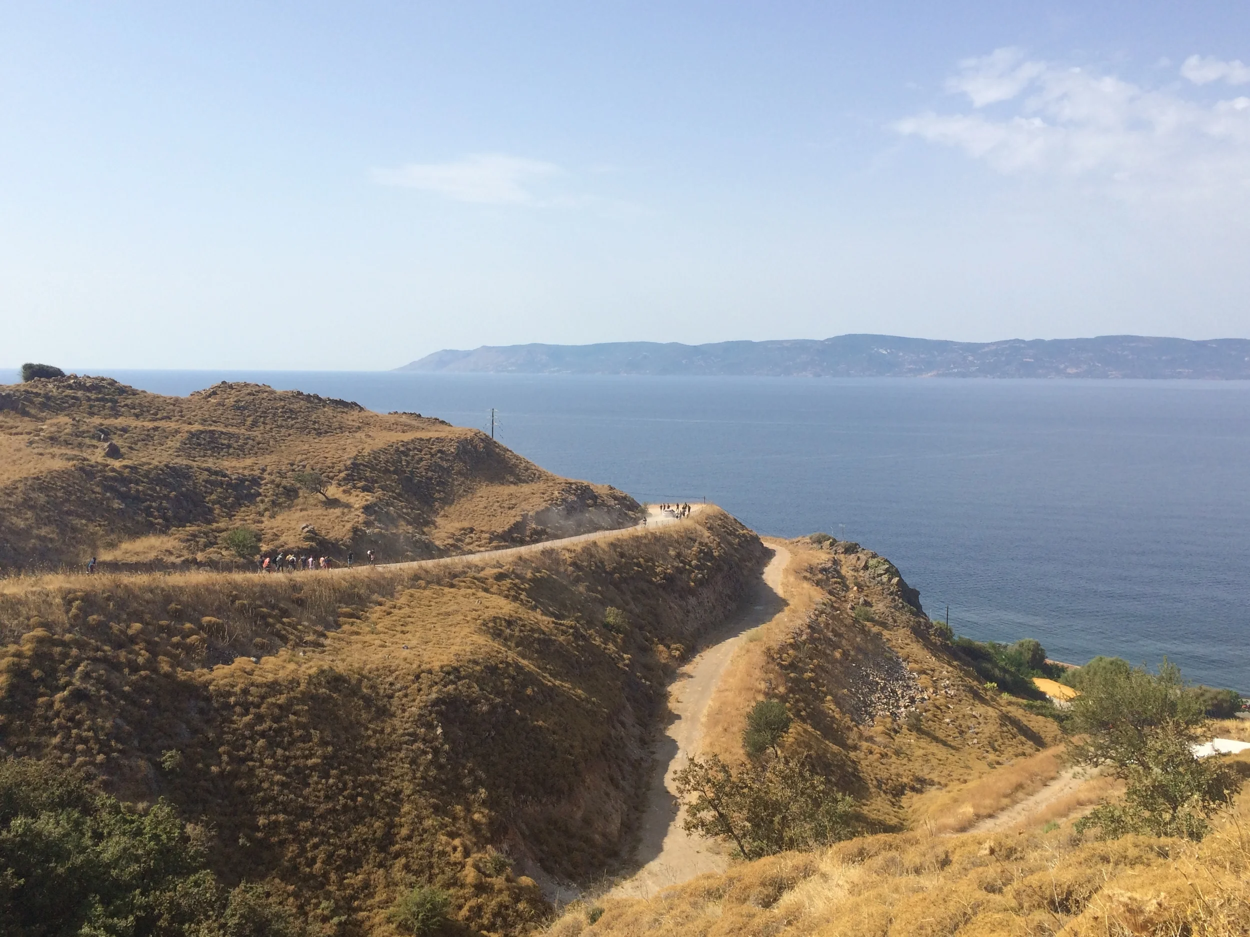 Migrants start the 50-kilometre walk to Lesbos' main town after landing on the island's north coast. © Katy Lee
