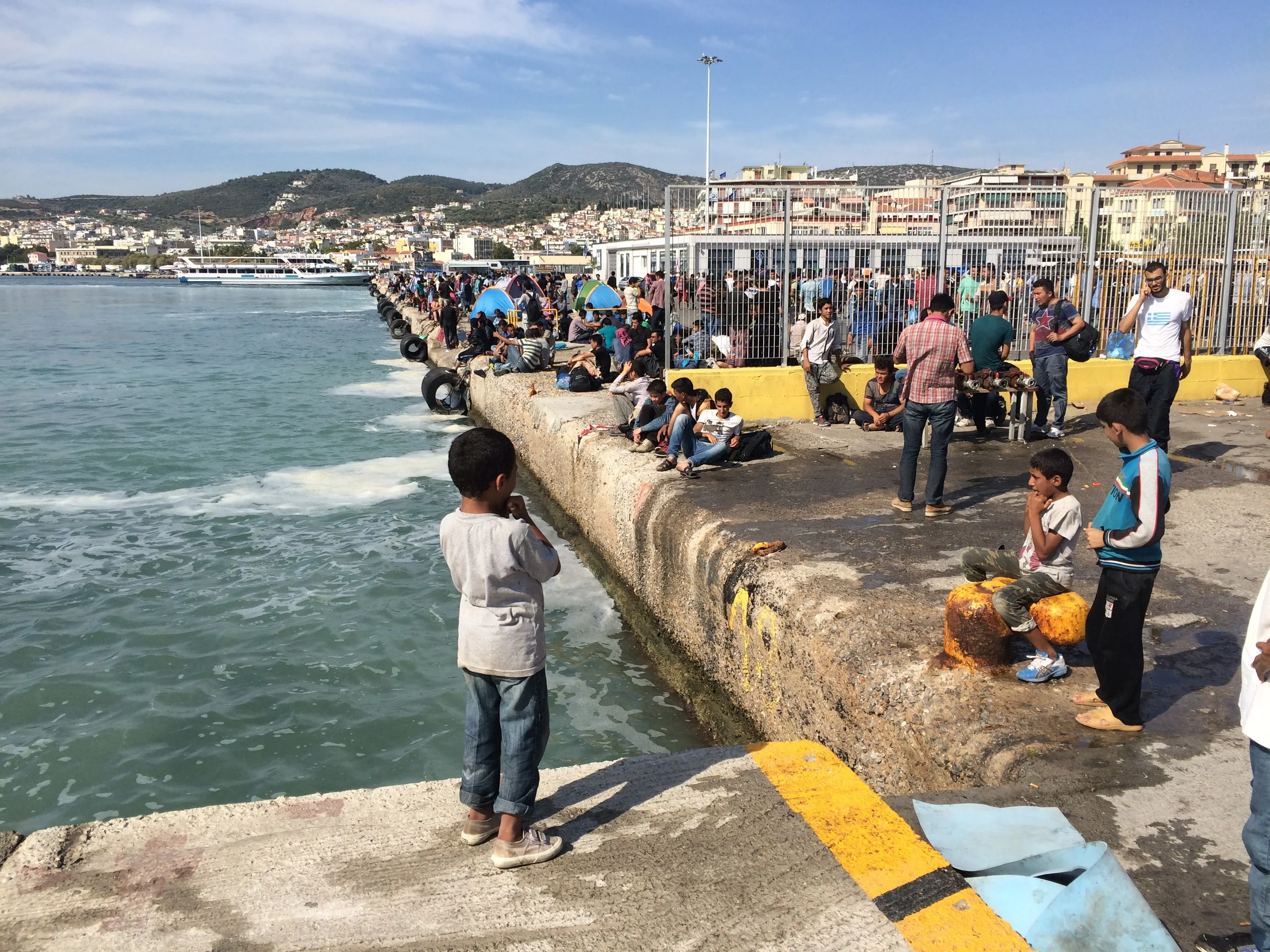 Refugee kids learning to whistle, Lesbos island, Greece. © Katy Lee