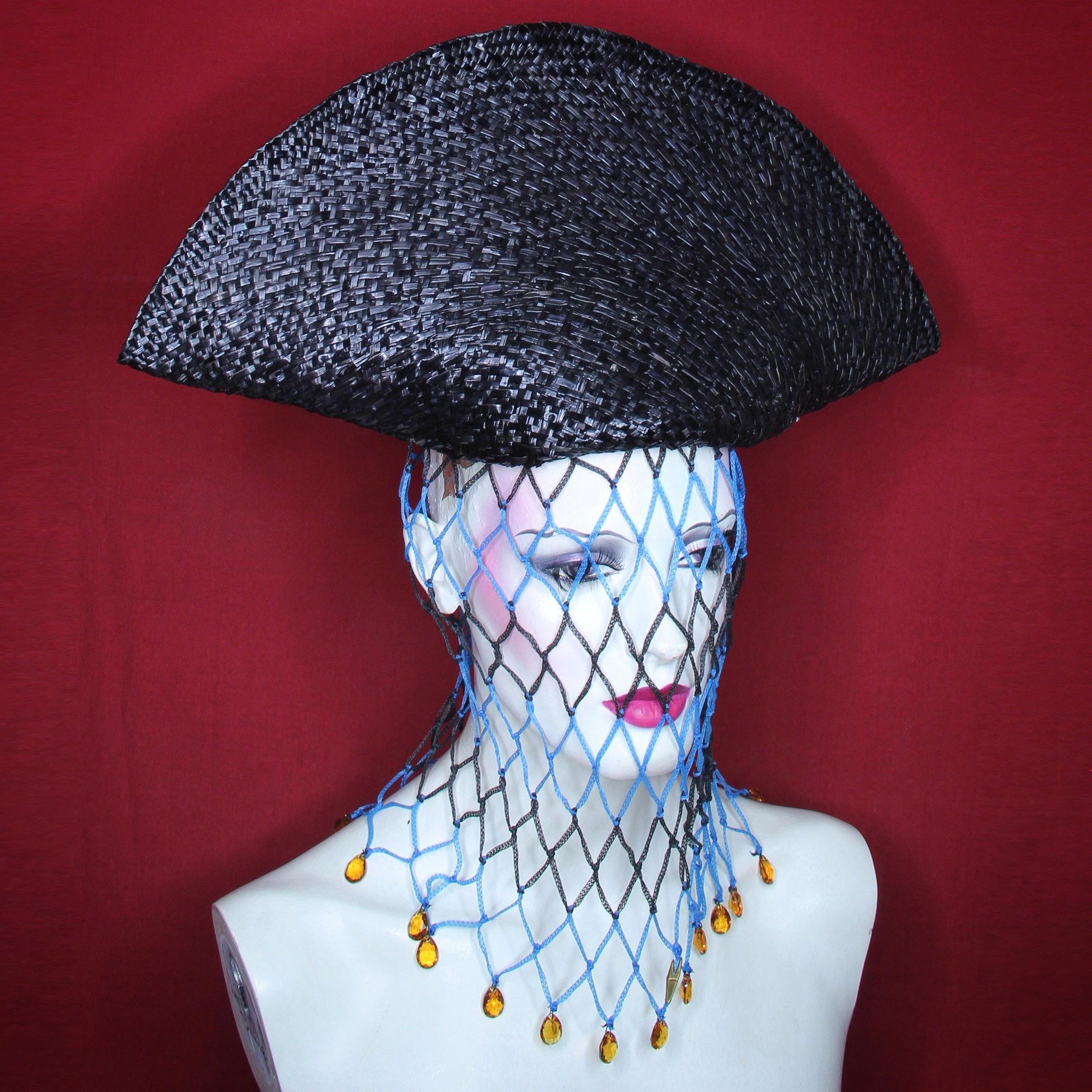 Collection 31. #workinprogress 
Vintage straw capeline folded up into a bicorn, fitted to head on semi-inverted crown; wired and stiffened, no cutting. No cockade. Worn over gathered string bag, weighted with crystal drop aiglets. 
NOTE: Consider nam
