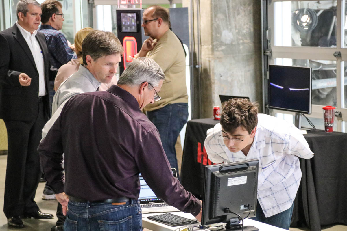 Attendees examine new connected device technology at Show&Tell 
