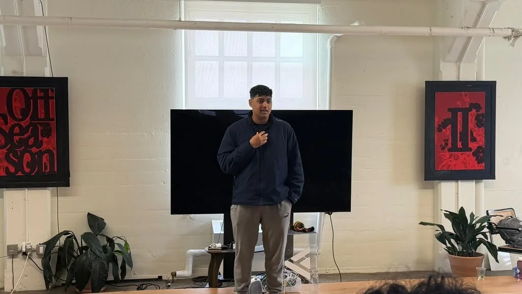 Photo of Shreyas Mavanoor presenting in front of a computer monitor. Photo source: Cortexa Labs.