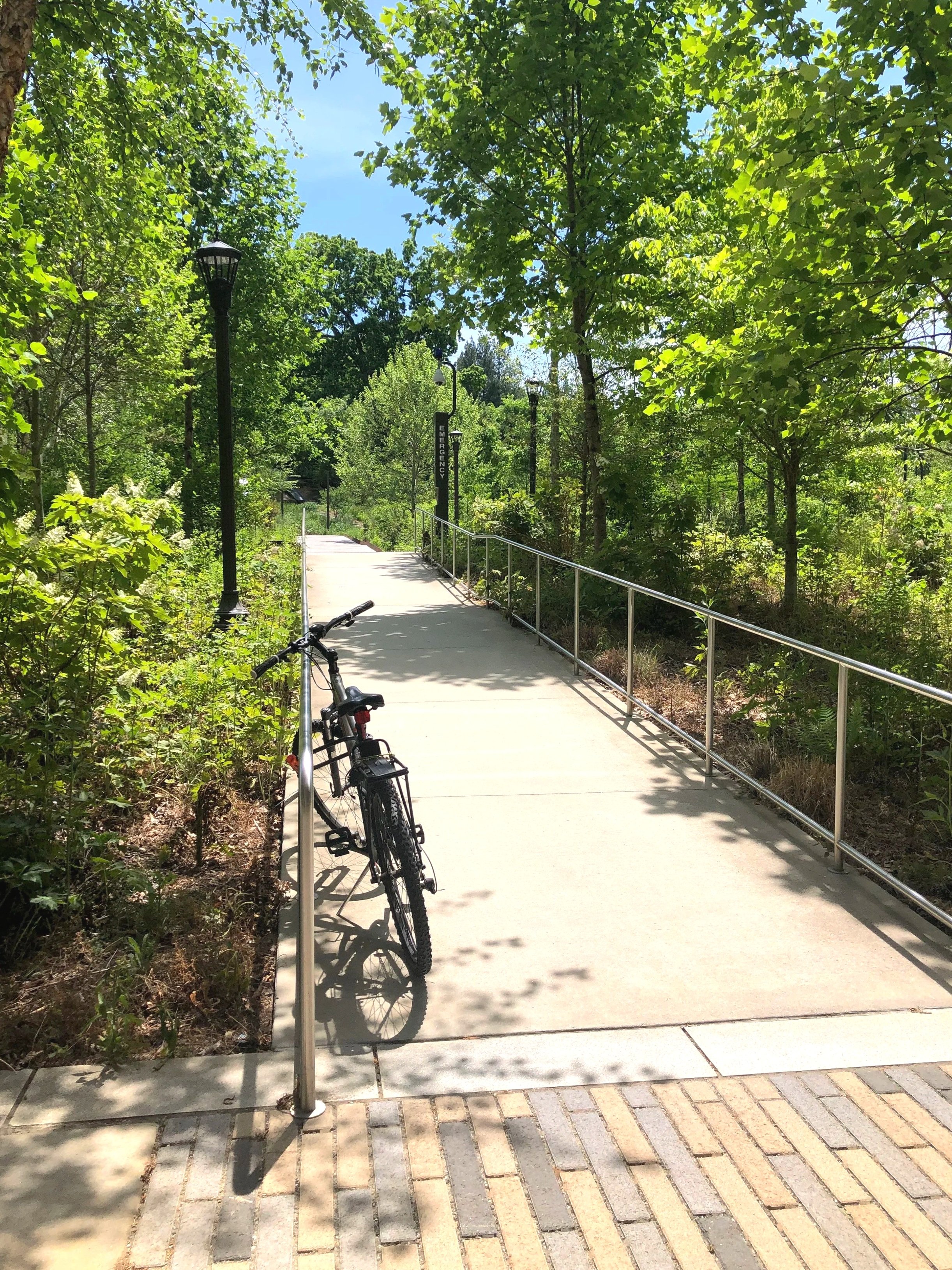 Photo of the Georgia Tech EcoCommons featuring a plant-filled greenspace with wooden paths near the building where the CURA 2026 Symposium was held. Photo: Pearl Kaplan/Tech Square ATL.