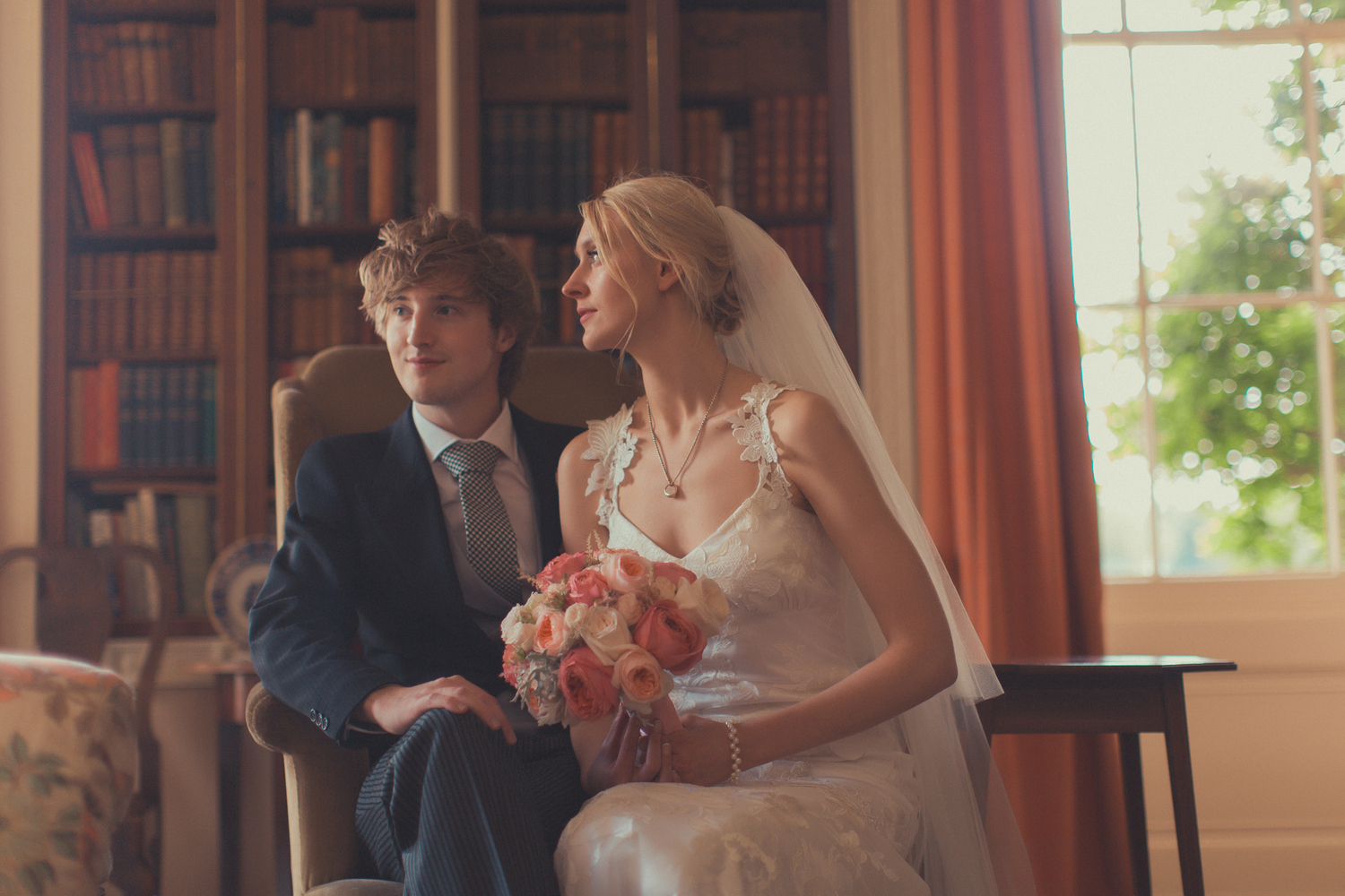 Summer wedding flowers in blush tones with accents of coral at Courteenhall, Northamtonshire