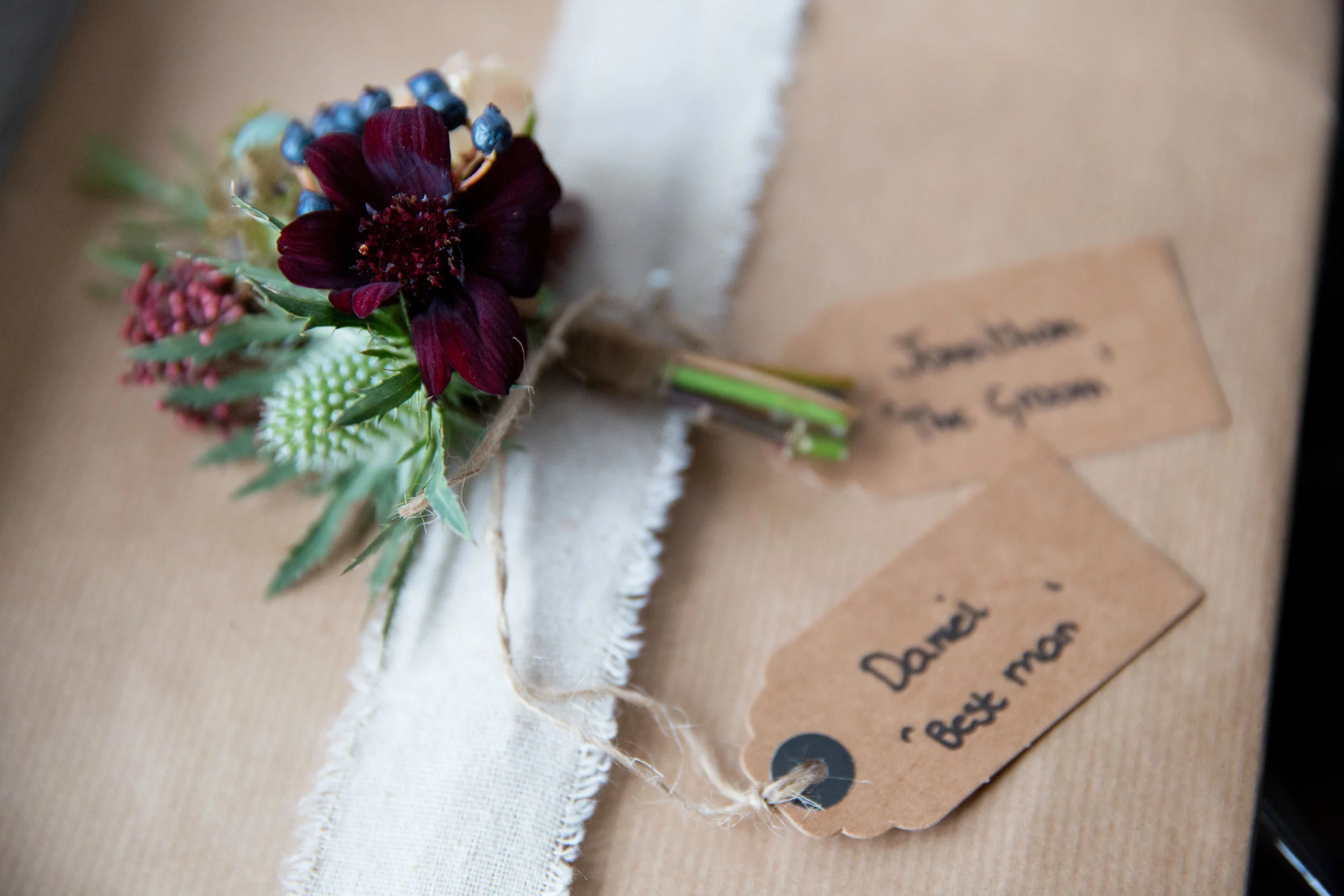 Autumnal gent's buttonhole with chocolate cosmos