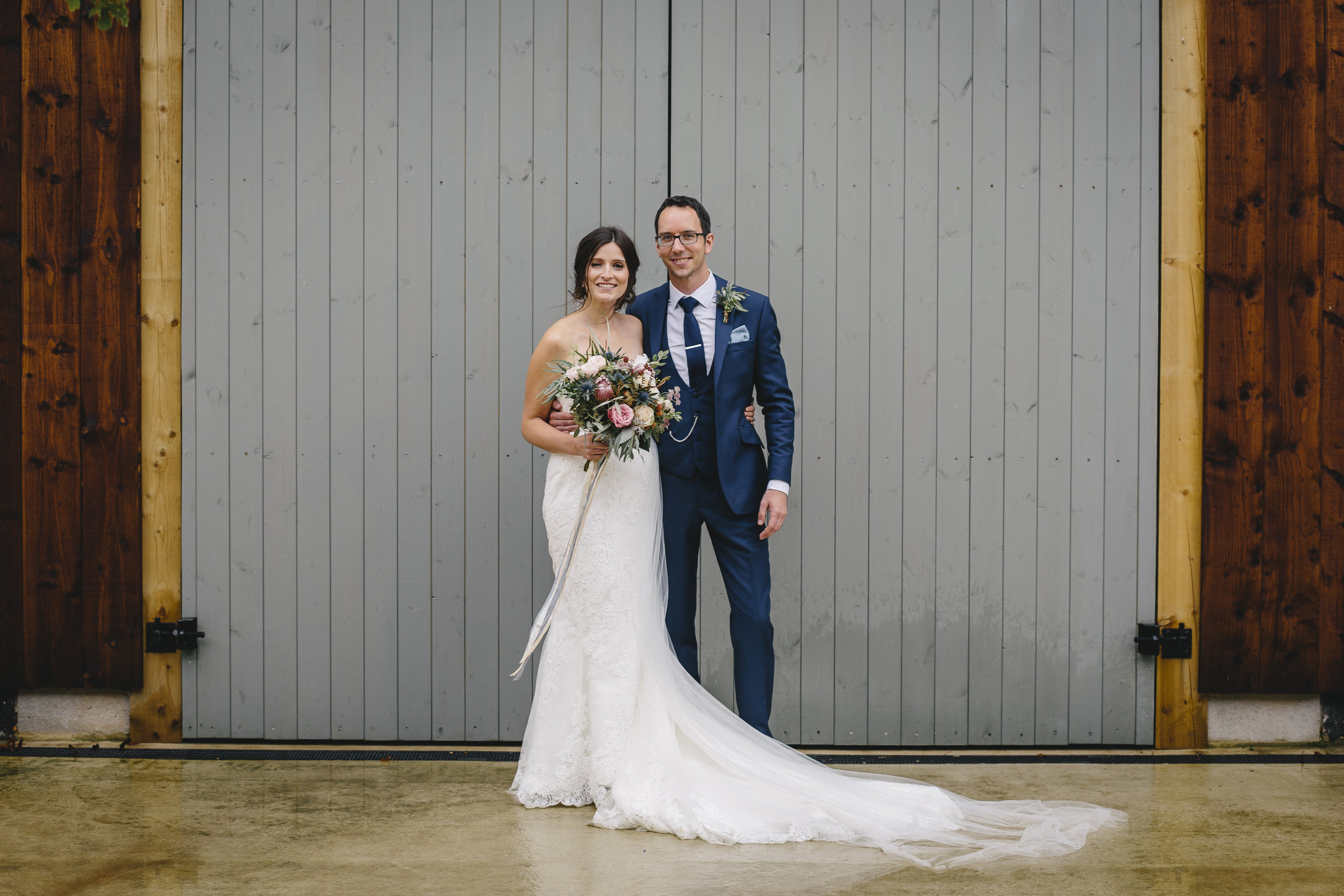 Natural bridal bouquet with protea, herbs and blush roses 