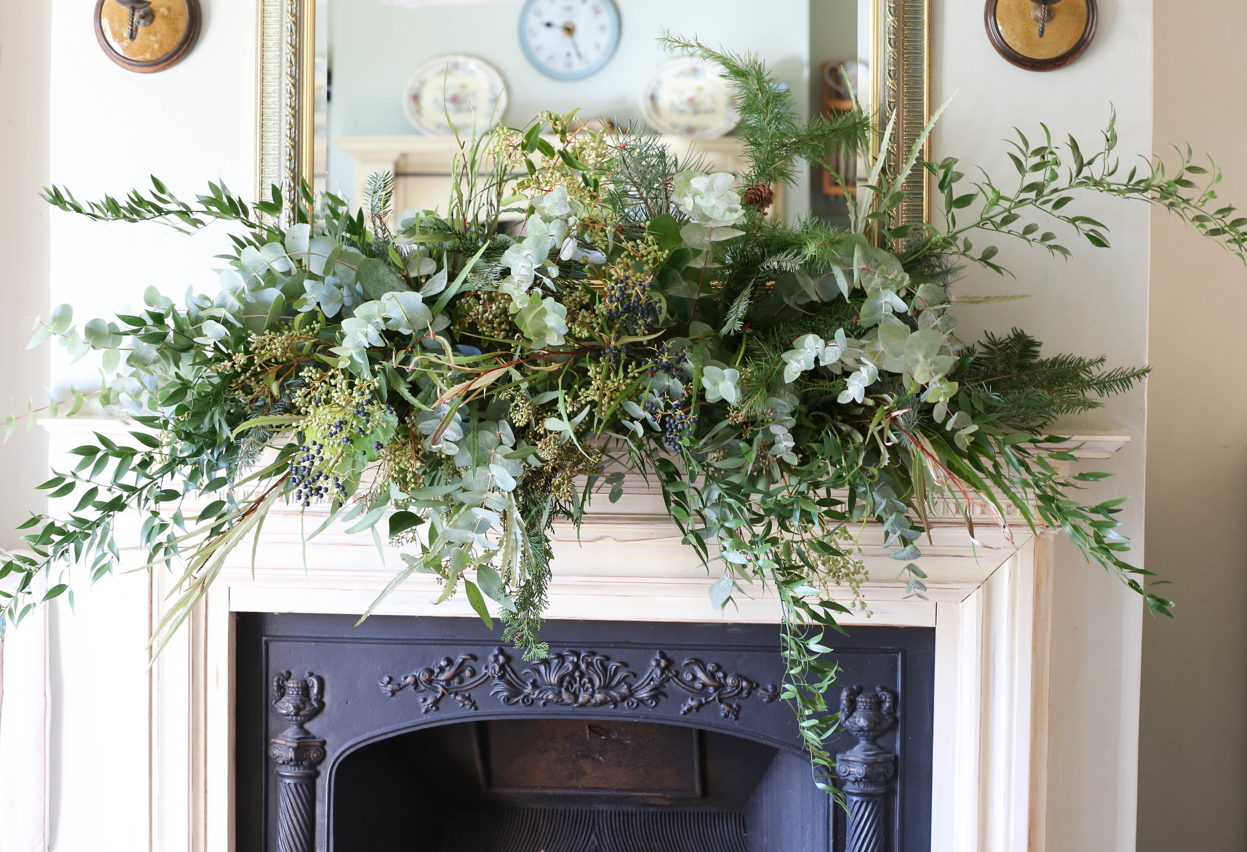 Festive eucalyptus fireplace garland