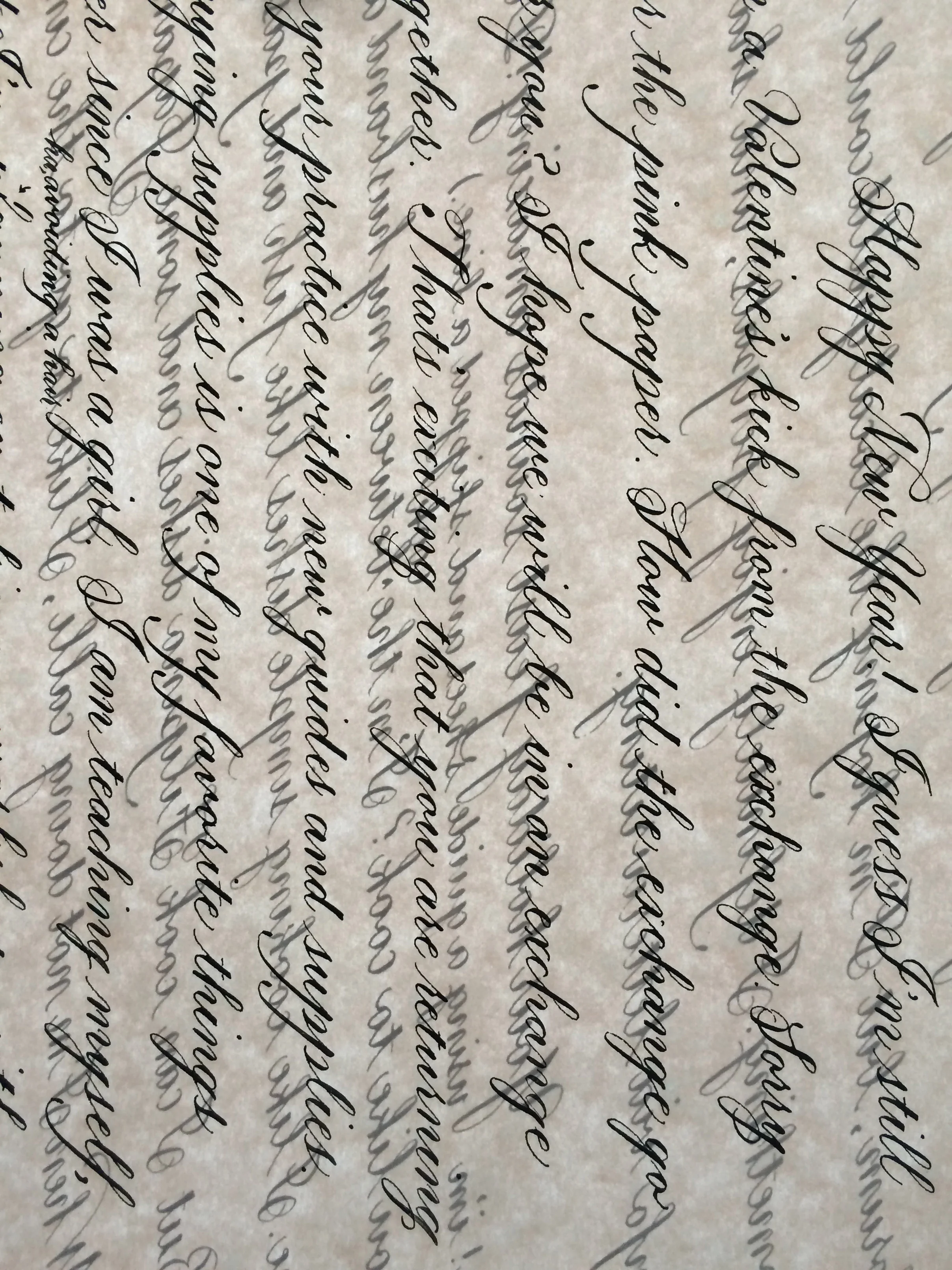 Letter written on pale pink parchment in the Copperplate style.