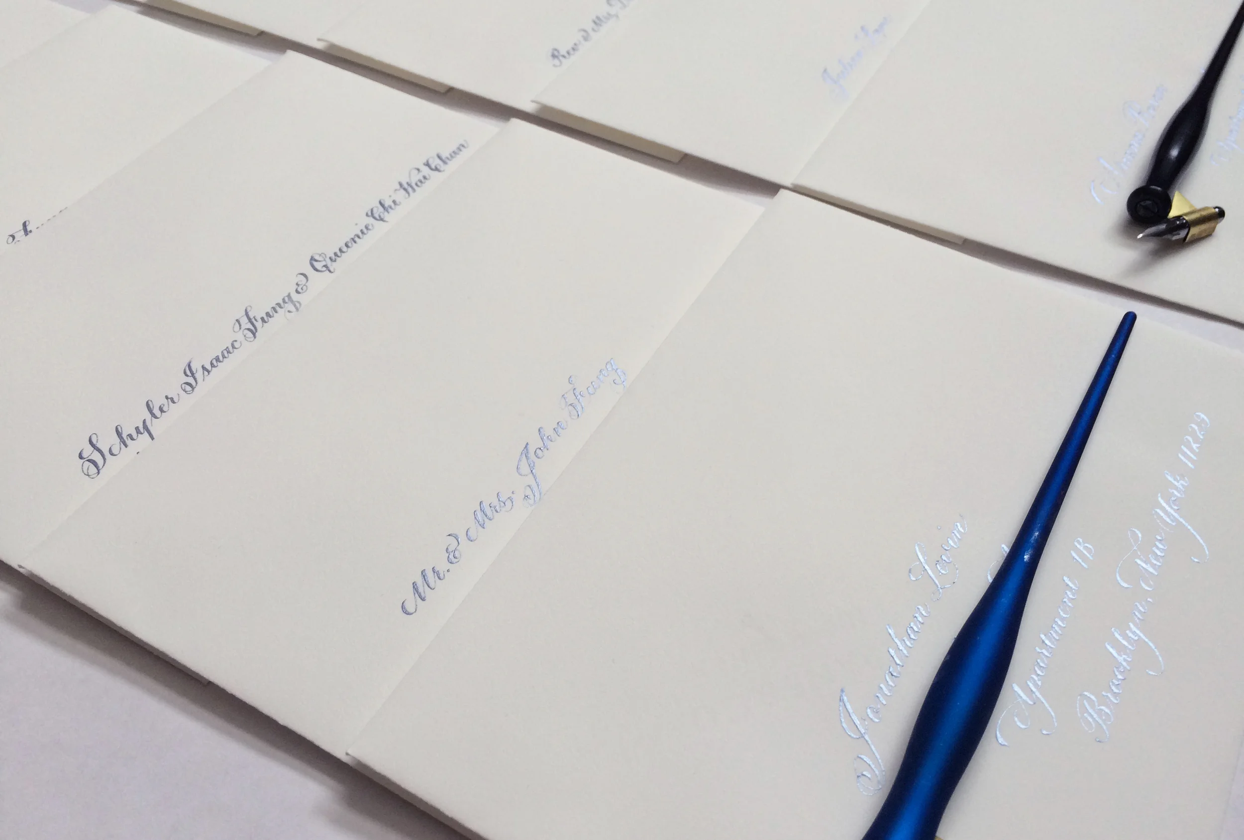 The soft sheen of blue: the hydrangea ink on the wedding envelopes.
