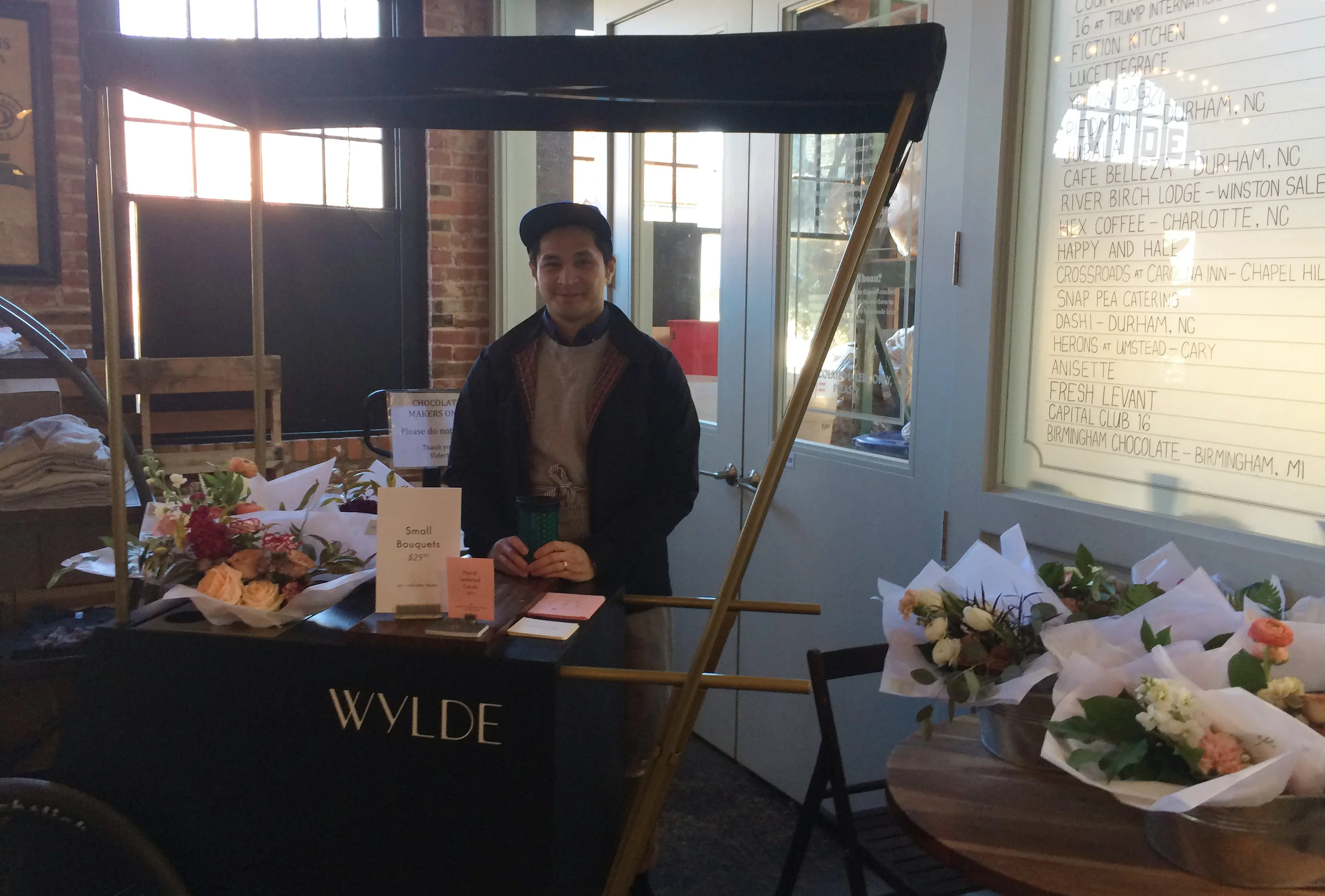 My brother and Nikelle's husband Gino selling bouquets at Videri Chocolate Factory.