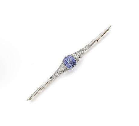  A bar pin featuring a collet-set cushion-shaped sapphire, with diamonds. Photo by Bonhams Auction House.&nbsp; 