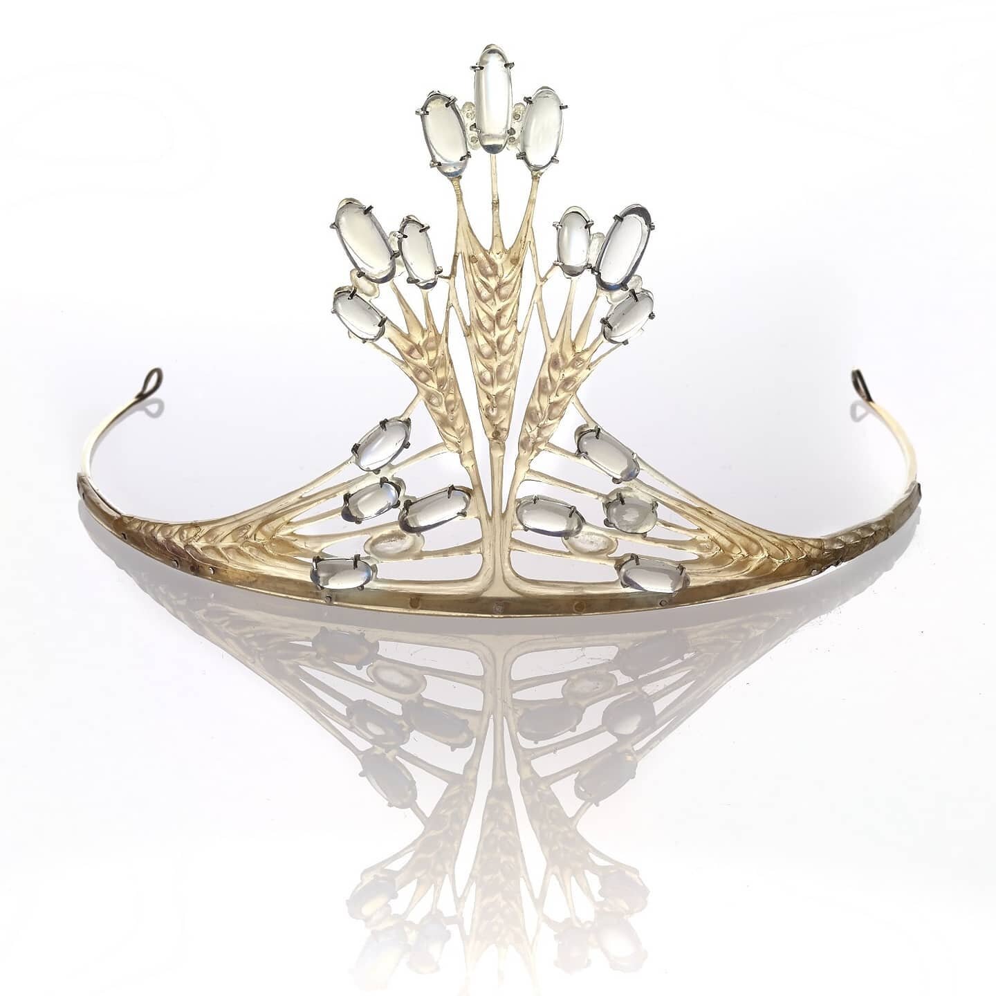 Tiara with corn featuring moonstones and carved horn by English jeweler, silversmith, and teacher of jewellery making Frederick James Partridge (1877-1942).
In 1910, Partridge set up a studio in Soho London where he designed for Liberty &amp; Co. amo