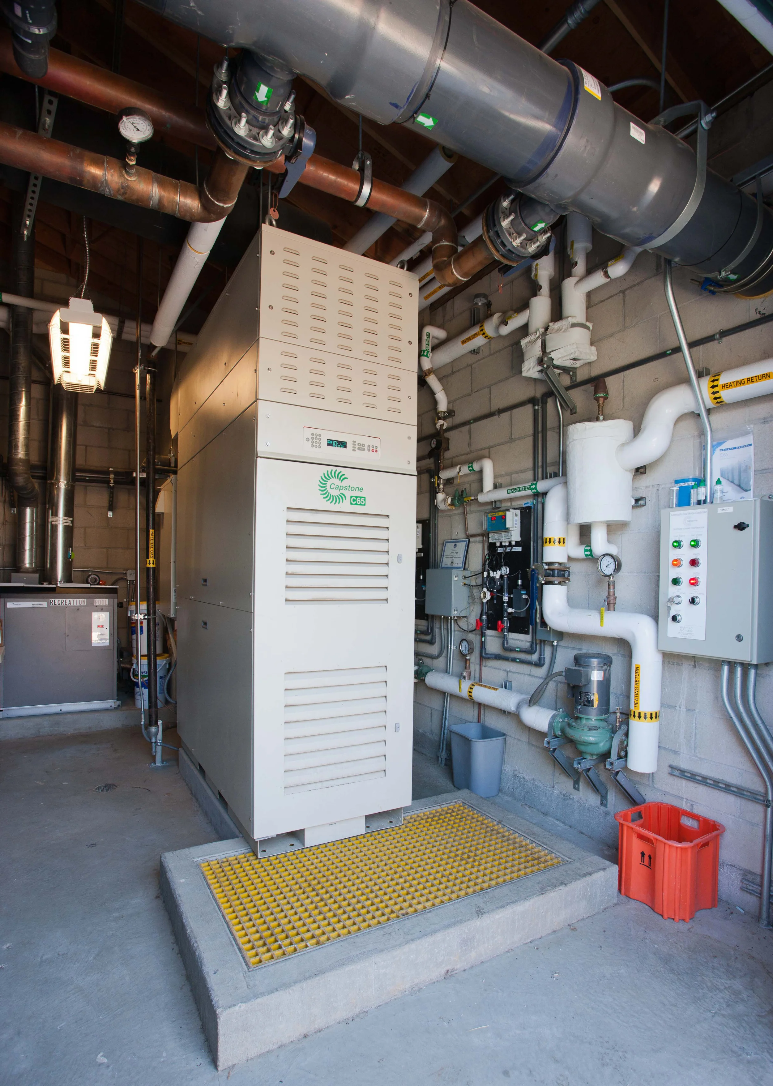 This 60kW microturbine may not look exciting, but it generates power for a school campus and heats 2 pools, essentially for free. Projected costs savings over 20 years is in the millions.