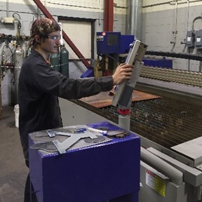 Justin Pumneo programs the state-of-the-art Messer EdgeMAX Dual X-Drive cutting machine