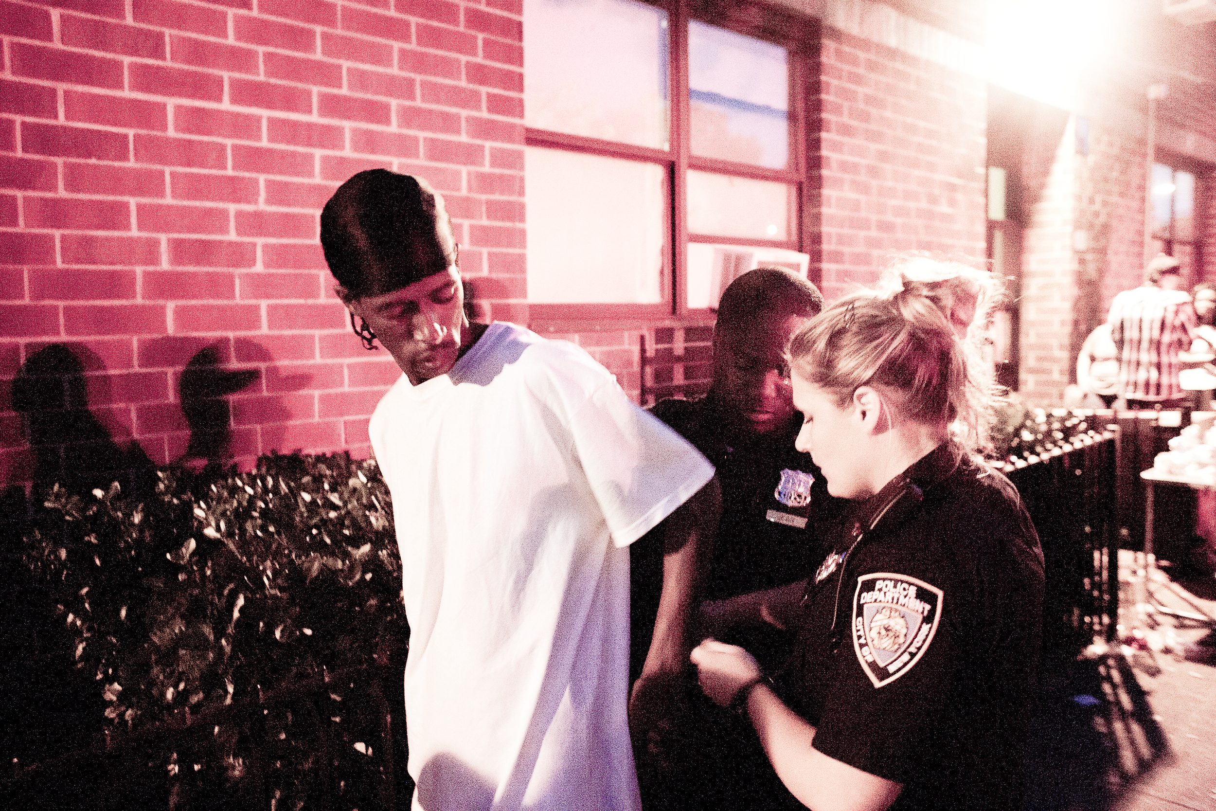 Police arrest a man with an outstanding warrant at a barbecue on Father's Day, 2013.