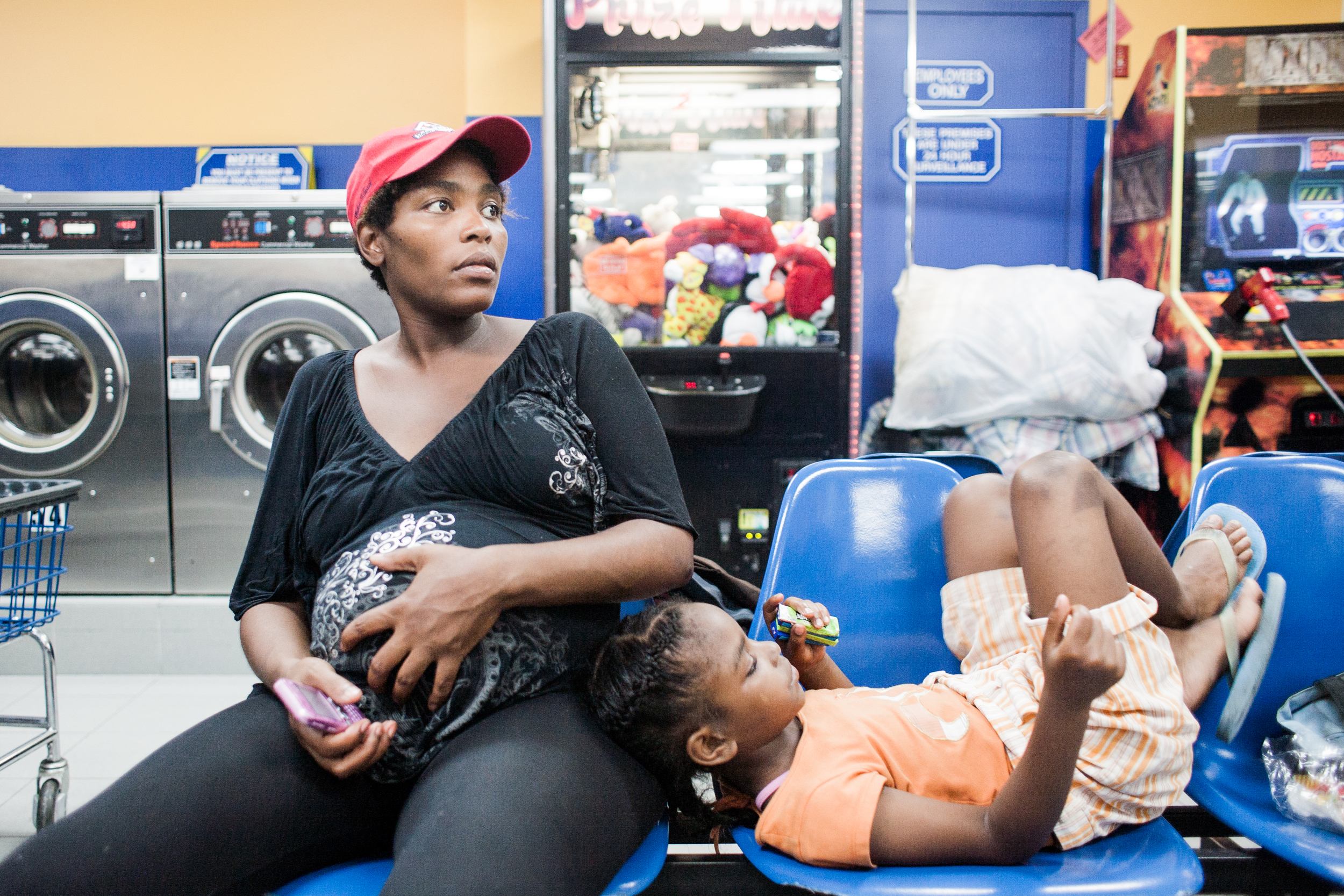 Roberta at the laundromat with Siera, 2010.