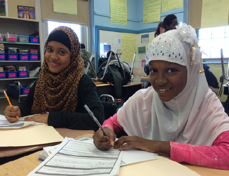 Middle school students prepare for student-led conferences during an advisory session.