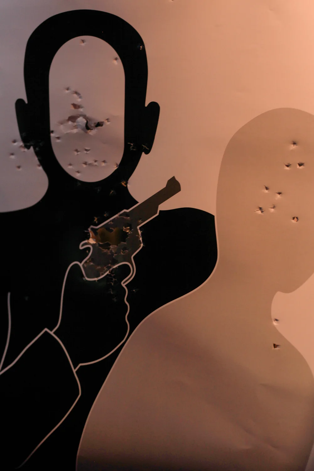 A picture of my target after we were done shooting. I made several scenarios in where I shot. Even one where the hostage was the bad guy...? I dunno. 