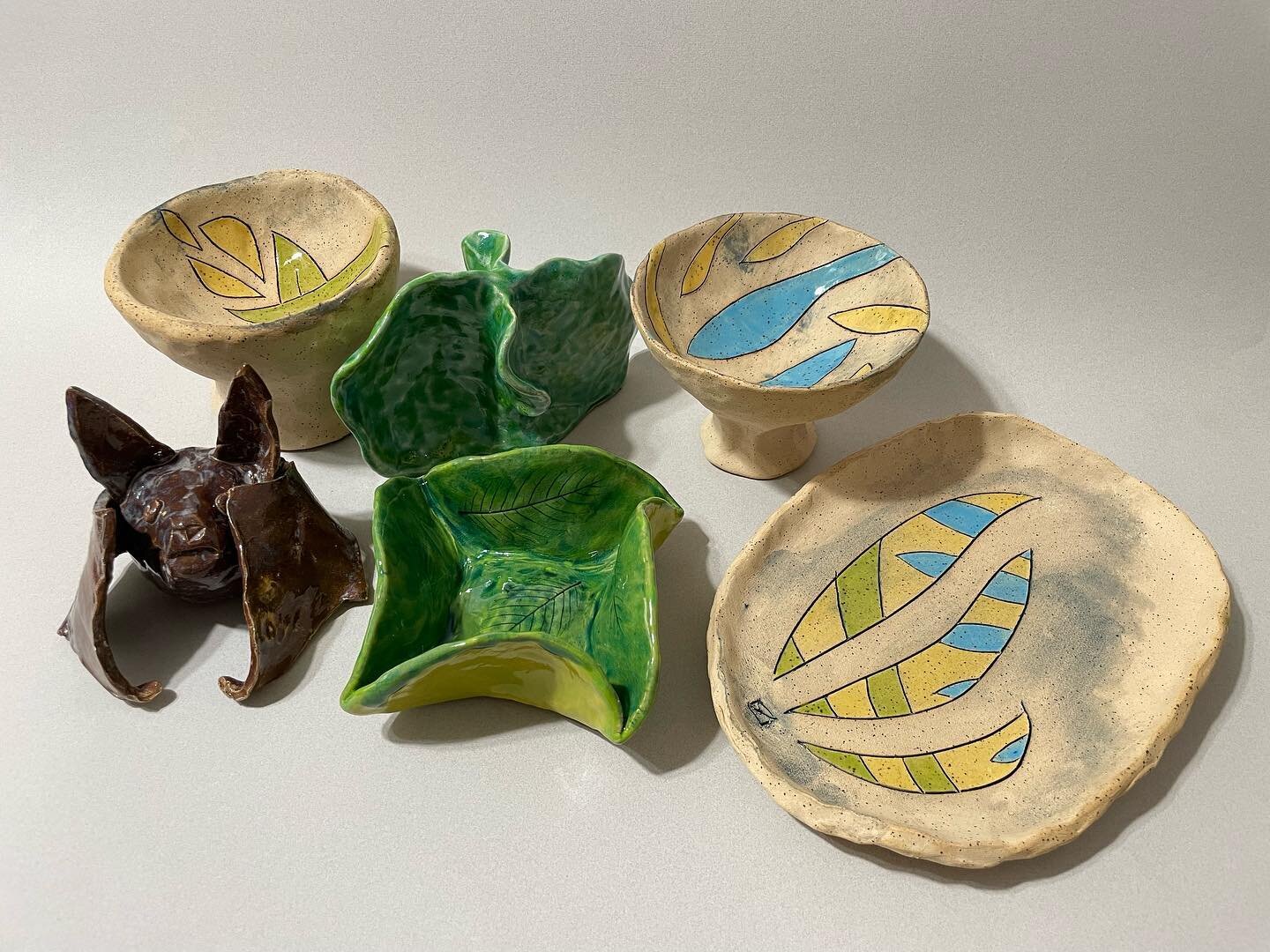 Latest handbuilt ceramics:

Low-fired white stoneware clay: Brown bat (with wing repair), Double Squiggle, and Twisted Square leaf dish

High-fired spectacular clay: two line bowls and a line dish.

#art #clay #ceramics #pottery #handbuilt #stoneware