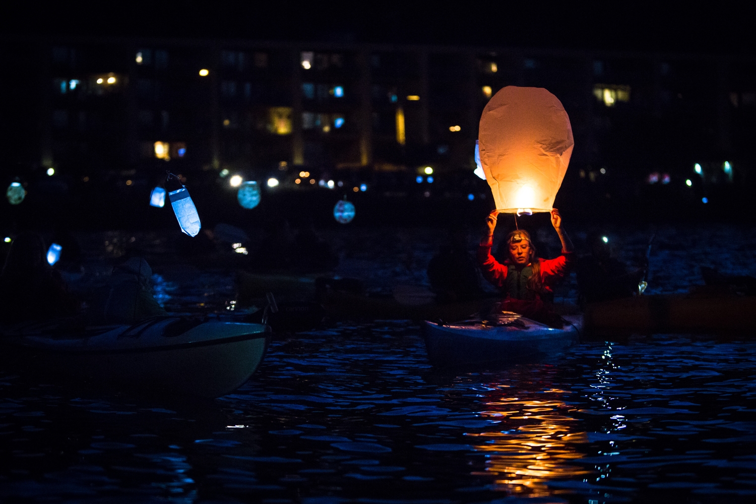  A kayaktivists prepares to release a lantern during a luminary flotilla protesting Shell's oil rig and proposed arctic drilling. 