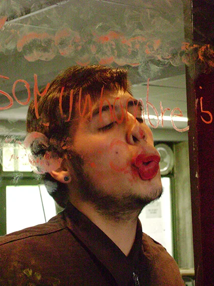 DAY I Monroy kissed the vitrine several times and wrote some thoughts on masculinity for the spectators to read. Overtime he started to look at someone face while he kisses. 
