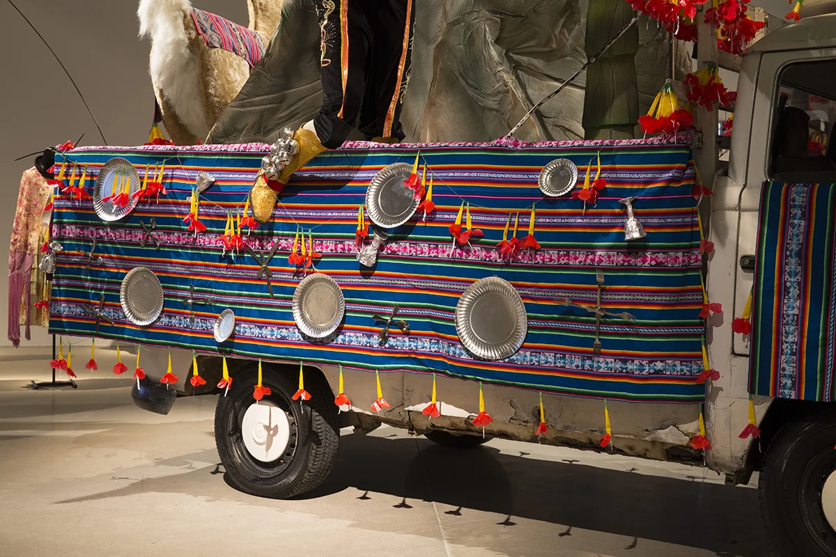 Details of Combilambada. Atabio a Bolivian Folkloric decoration on the sides of the truck done with aguayos (indigenous fabrics), silver cutlery, porcelains and stuffed animals. 
