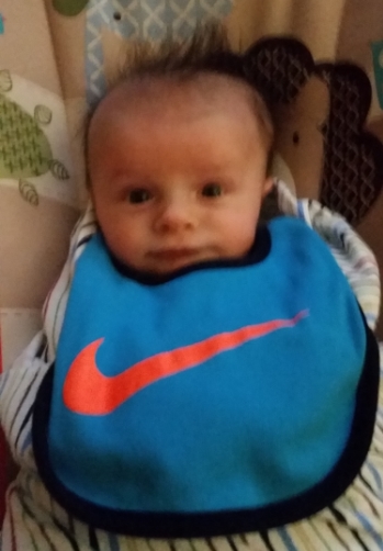 For those of you who are here to simply see an updated picture of William. Here he is sporting his Nike bib after a midnight feeding. Who needs sleep, anyway? Not William (apparently).
