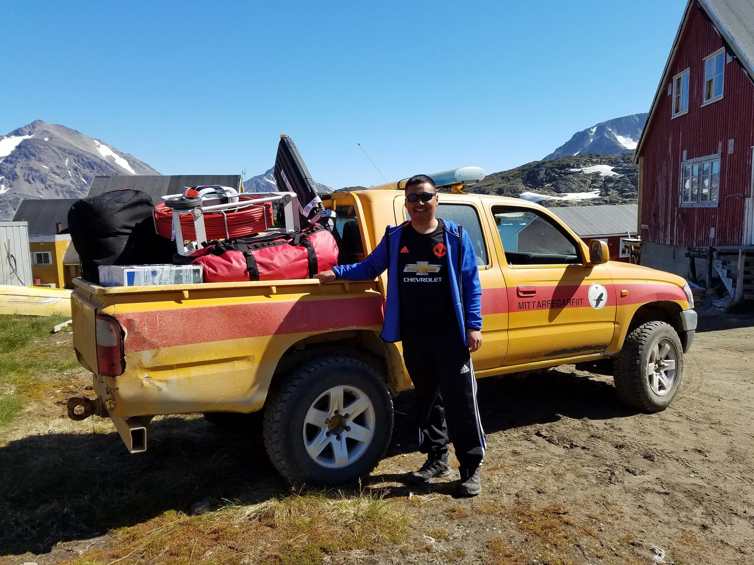 Jokum Mikaelsen assists in transporting equipment in Kulusuk.