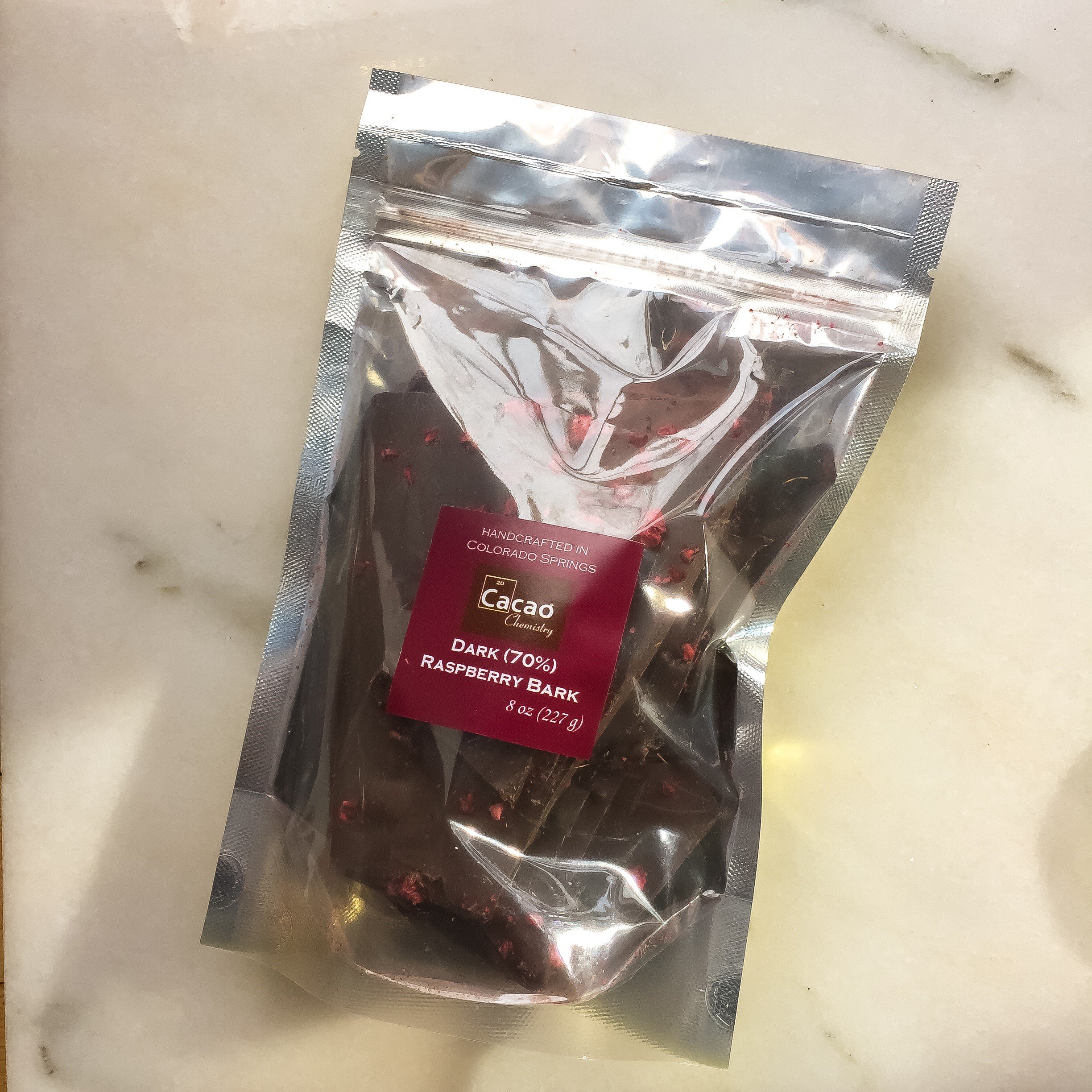 8 oz size dark chocolate bark with tart raspberry pieces – gift-ready packaging