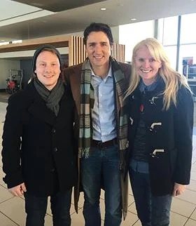 Adam (left) and Amy Clifford (right), Director of Global Vision, photographed with Prime Minister Justin Trudeau whilst representing the organization.