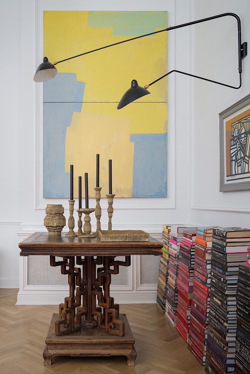 Antique Chinese table, cast brass candlesticks, vase and tray all by Alexander Lamont. Painting by Joseph Goody.