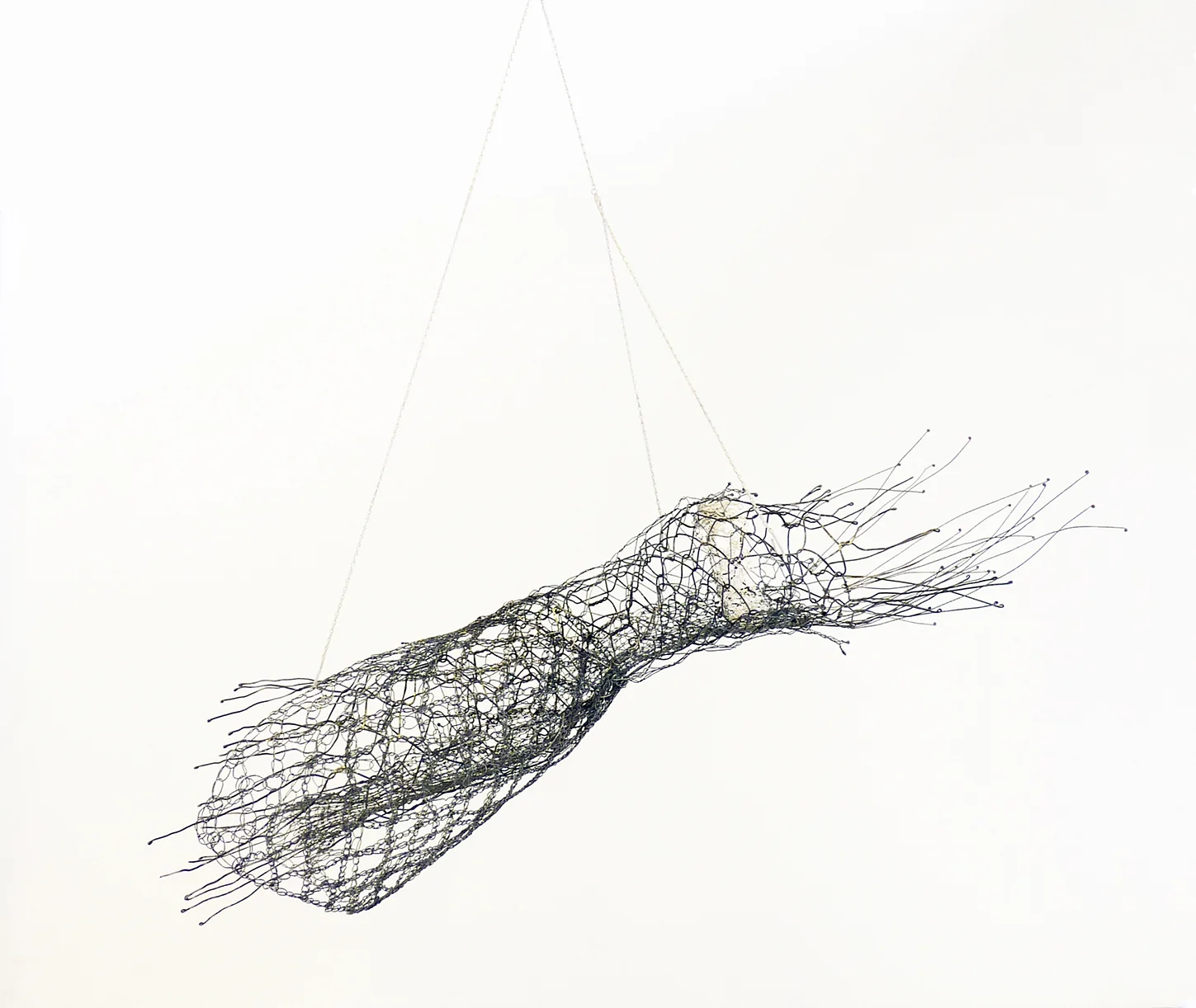 Here the maiden lays her down/Her shroud her wedding gown from the poem 'On a distant prospect of Girton College' by Olive Fraser oxidised silver; knitted, crocheted. 2013