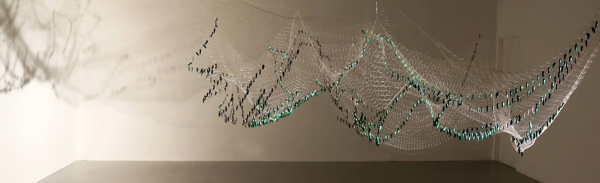 Shoal Installation - Thai fishing net, Sternocera Aequistignata beetle wings. 2015