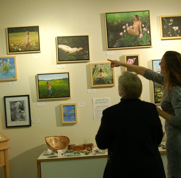 Debbie discussing her pieces at the show opening at Summer Island Studio on December 13, 2014.