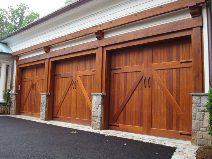 Nice detail all around here! Beautiful wood doors and trim mixes well with the texture of the stone bases and edging. 