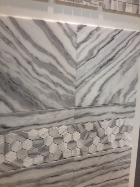 I love how the top tiles are laid in a way to create a chevron pattern. A little of this goes a long way.