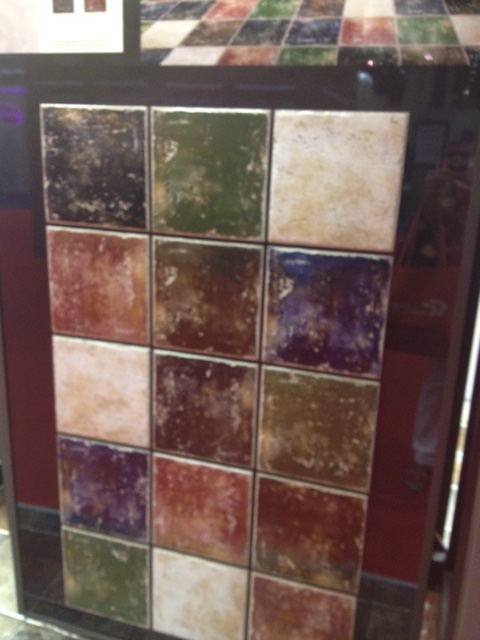 These ceramic tiles have a great patina. They would be beautiful to create a checker board floor out of 2 of the colors. 