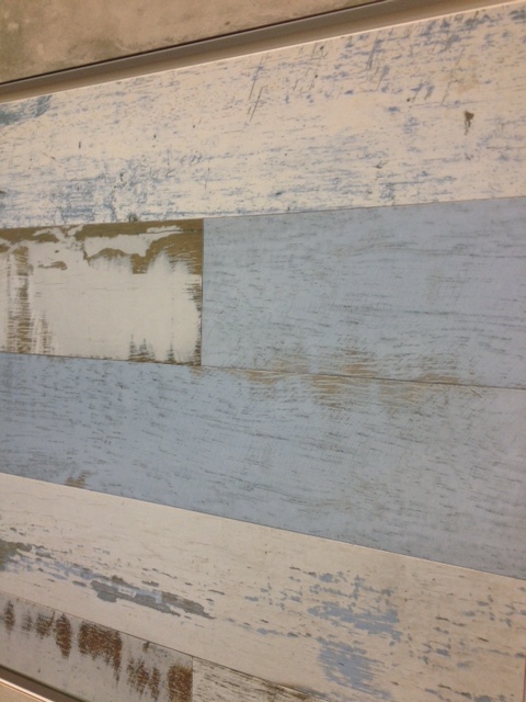 Ceramic tile that looks like distressed wood. Perfect for wainscoting in a beach or mountain house.