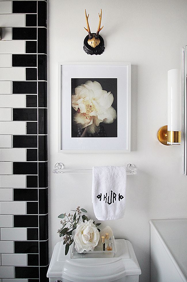 Lucite towel bar and fittings, simple and elegant. Love the tile detail, too.