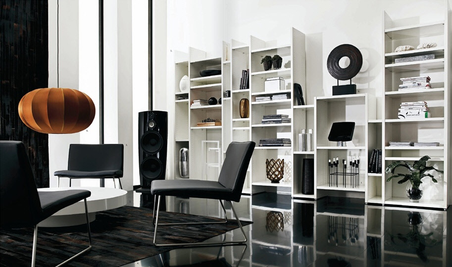 This room is simple, believe it or not! Simple white shelves are the perfect backdrop to objects of art. The black glossy floor reflects the shelves and art. 