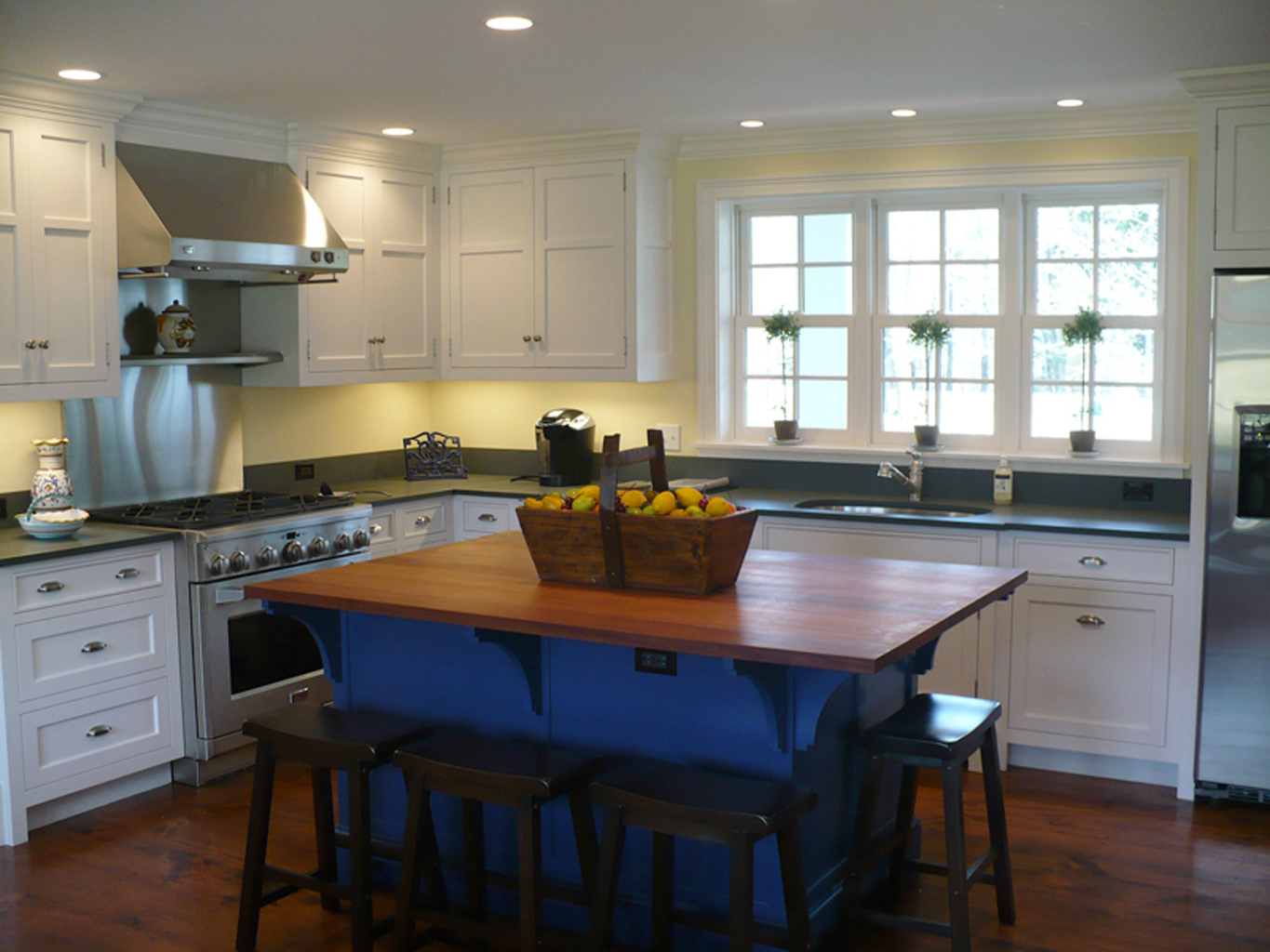 This island's mahogany top is a nice contrast to the perimeter slate counter tops.