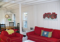 The walls, ceiling and trim in this 1860's cottage on Martha's Vineyard is painted white. It provides a nice backdrop to the bold furniture.