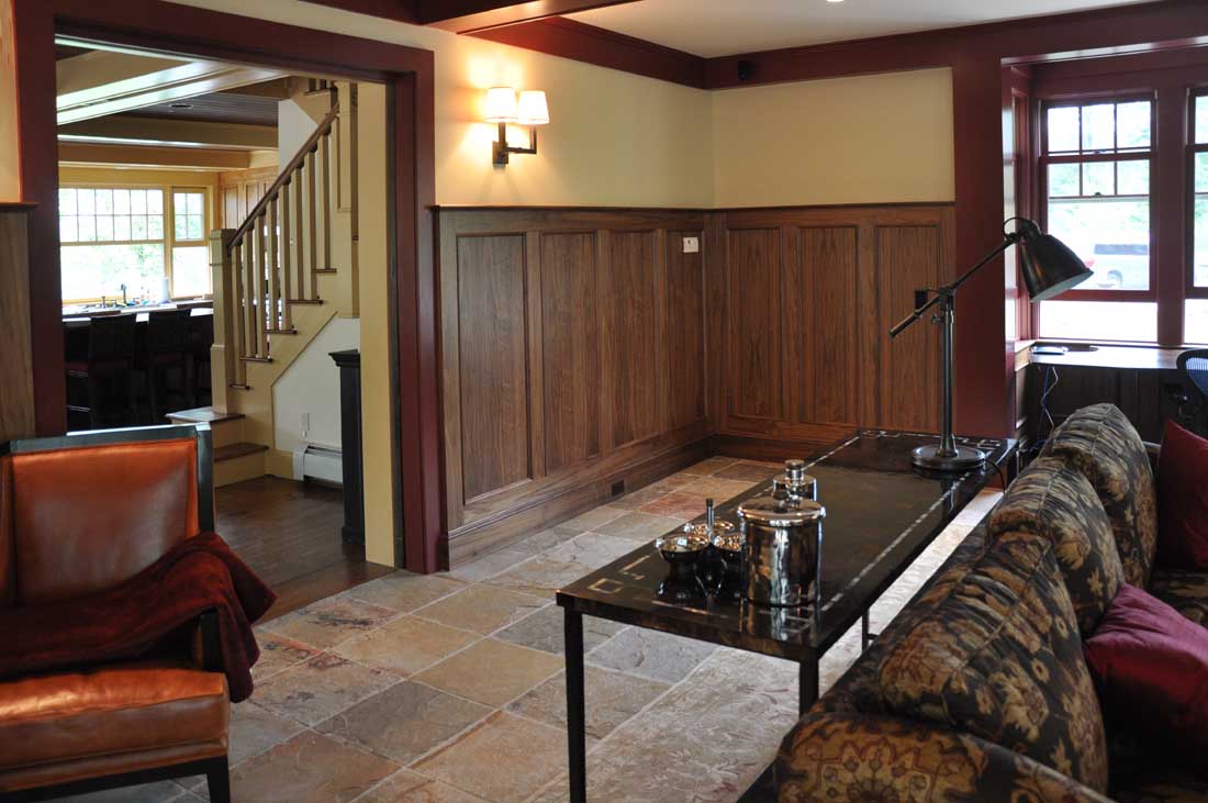 I worked with Dorset Custom Furniture on this project. They milled and installed the walnut paneling and I chose Benjamin Moore's Rich Cream , eggshell finish for the walls.