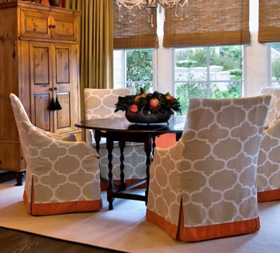 A little orange band and kick pleat insert goes a long way on these slip covered chairs.