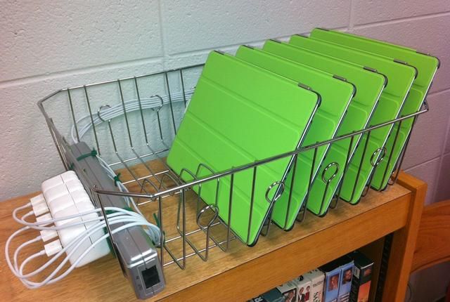 I am sure a teacher on a limited budget came up with this! A drain rack power strip and zip ties! 