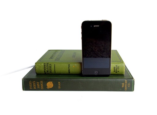 Hollow out a book to hide the cord(s). Just make sure it isn't a signed first edition!