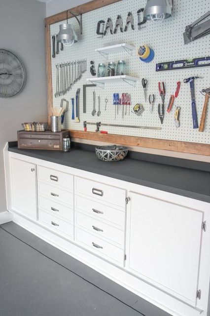 A clean and practical storage/workbench solution. If only my husband's workspace was this easy on the eyes! 