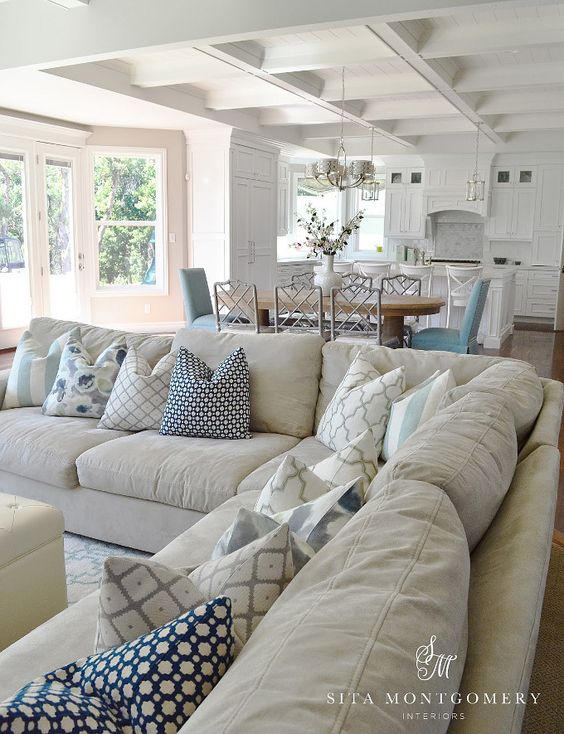 This neutral living/dining space begins with the right mix of muted colors but introduces hues of blue to add visual interest and warmth to the space.