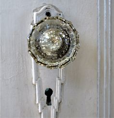 Okay, so it's technically not colored, but jewellike door knob exemplifies the magical, mesmerizing power of glass. I don't know whether I'd install it, or wear it!